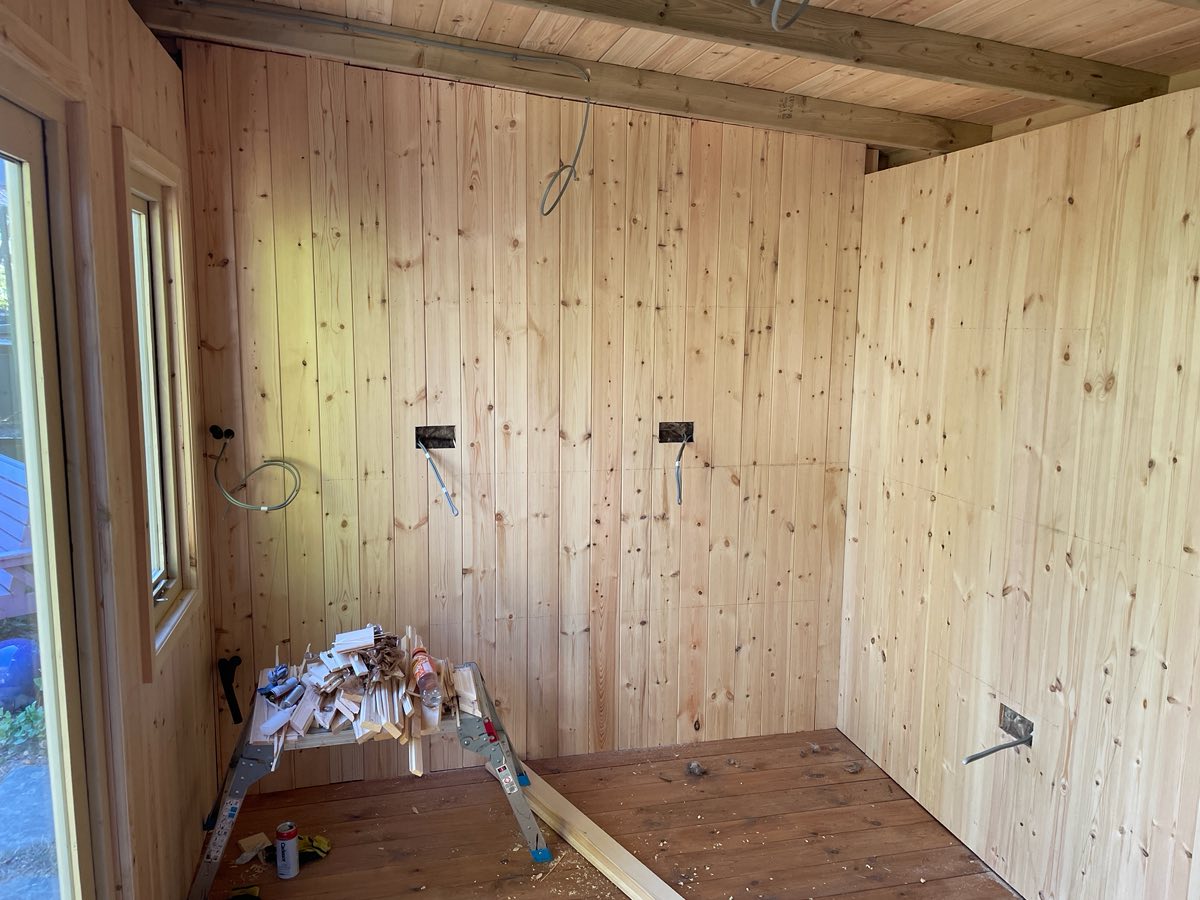 The inside lined with pale pine boards, with new sockets on the wall