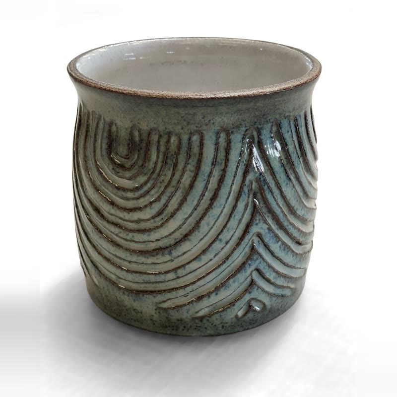 Carved stoneware vessel in speckled blue-grey glaze with sweeping arch lines