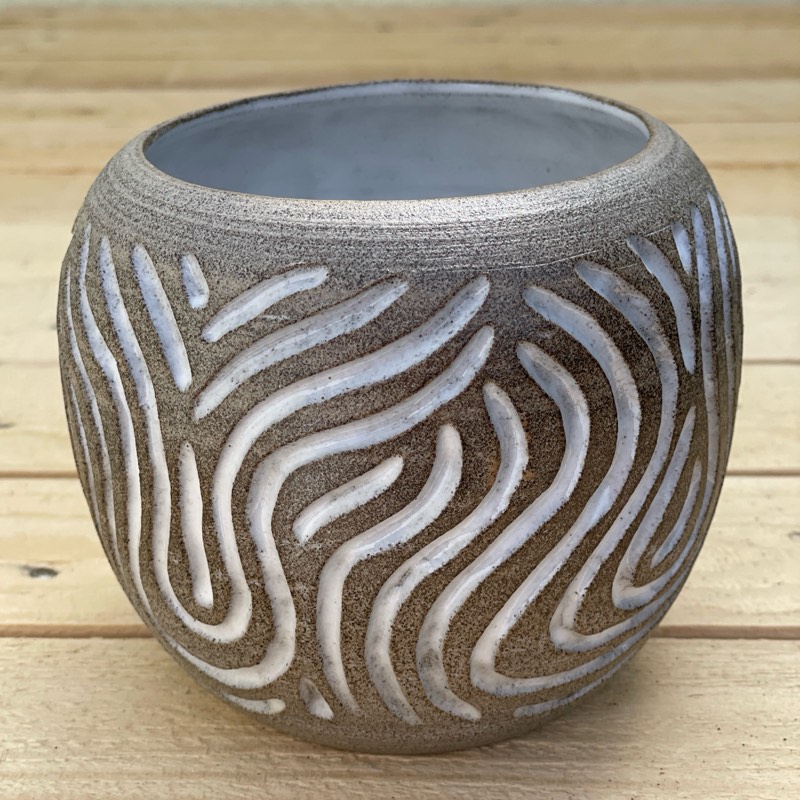 Grey speckled vessel carved with white-glazed wiggling lines