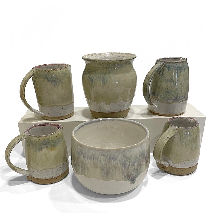 Iron lustre mugs, jugs and bowls grouped together