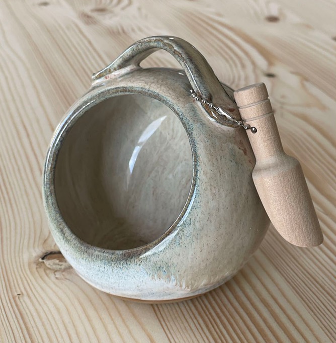 Round cream salt pig with a handle and a little wooden spoon