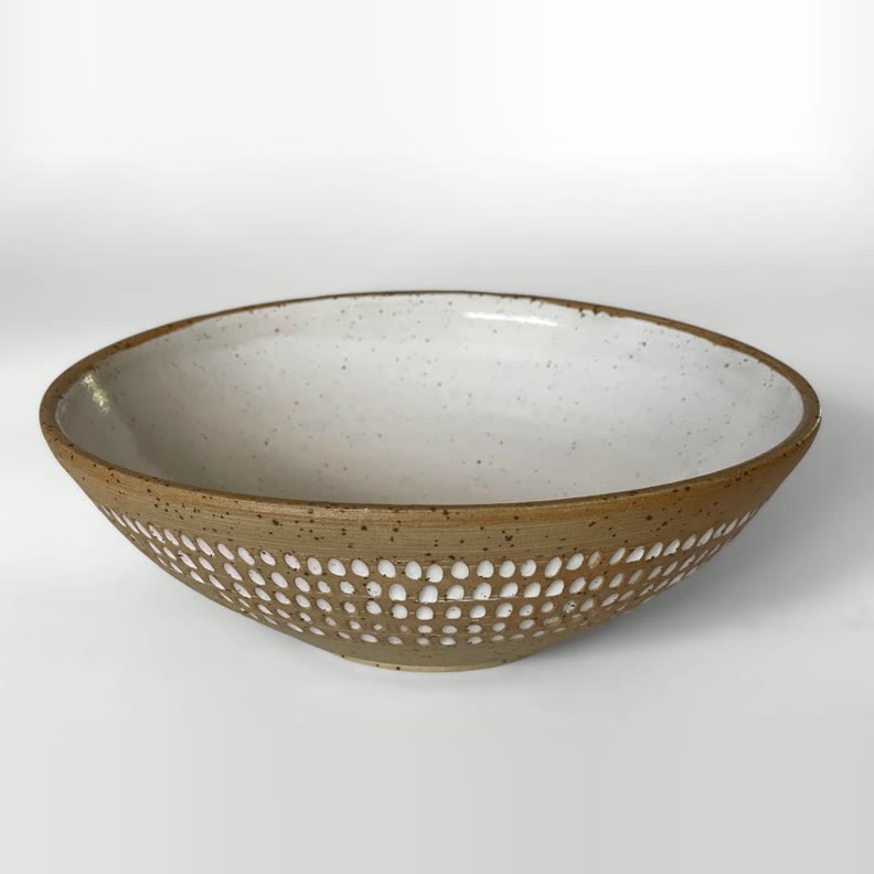 Shallow speckled bowl with a low band of carved dots