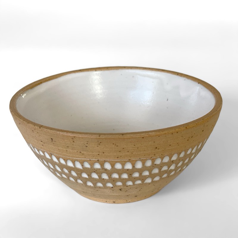 Wide speckled bowl with a band of carved white dots and a white interior
