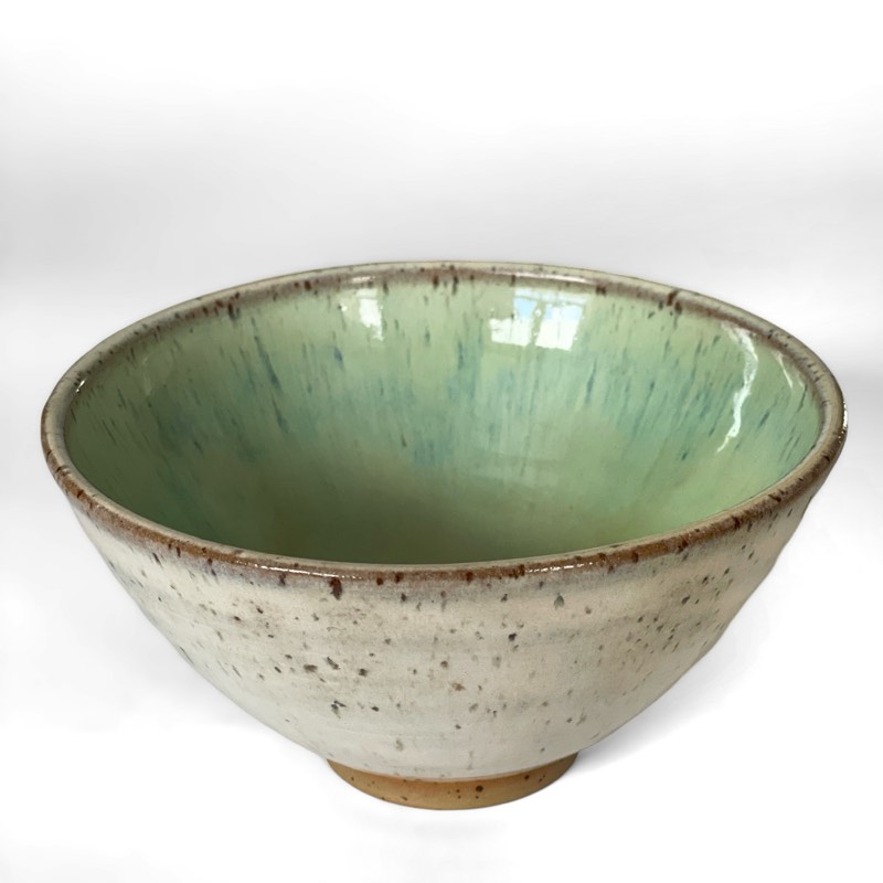 Speckled cream bowl with a pale green celadon interior