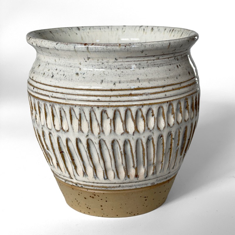 White speckled vase carved with rows of long drops